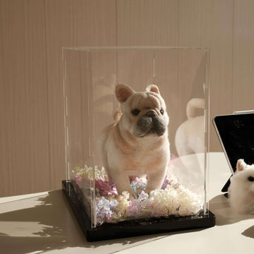 Woolly Pet Full Body Sculpture of a dog in a glass case on display, surrounded by pastel flowers, perfect for pet commemoration.