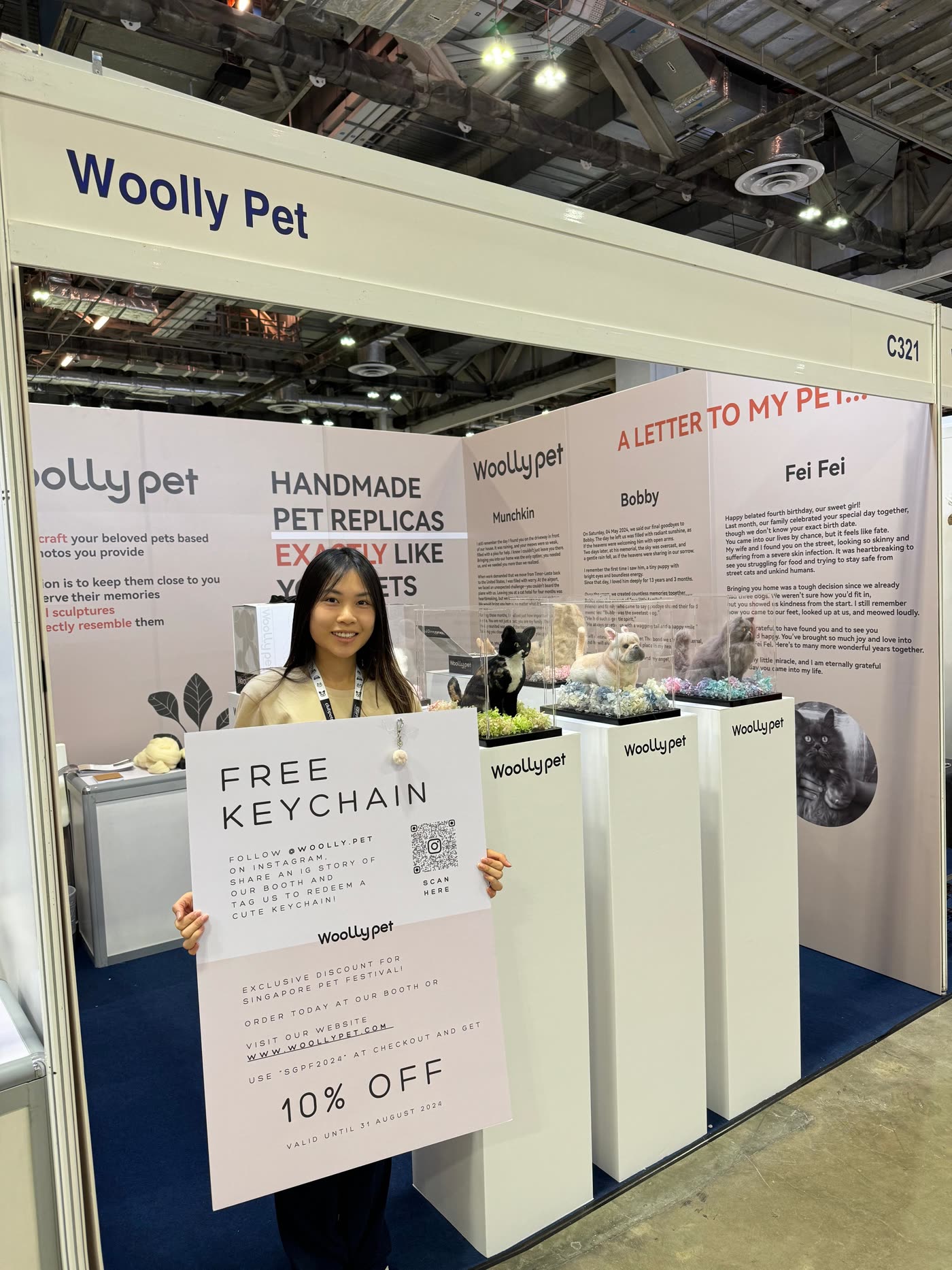 The Woolly Pet booth at Singapore Pet Festival 2024, with felted pets on pedestals